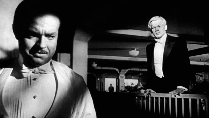 A dramatic scene from Citizen Kane (1941) featuring two men in formal evening wear
