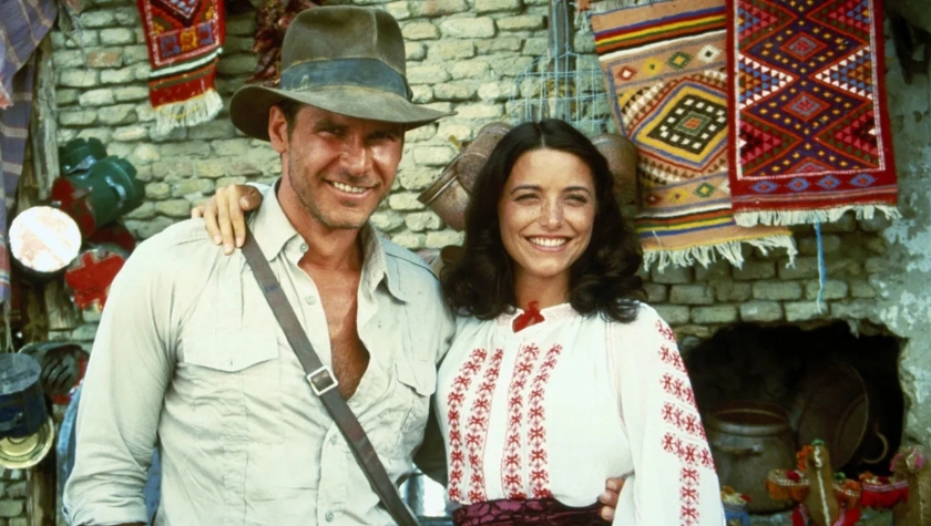 Harrison Ford as Indiana Jones with his arm around Karen Allen as Marion Ravenwood in Raiders of the Lost Ark