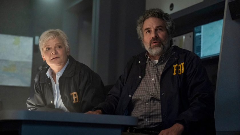 Tom Brandis (Mark Ruffalo) and a female FBI colleague in jackets at a command center in Task on HBO