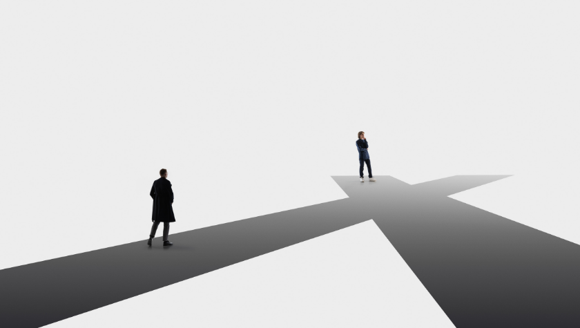 2 nondescript people standing at a crossroads 