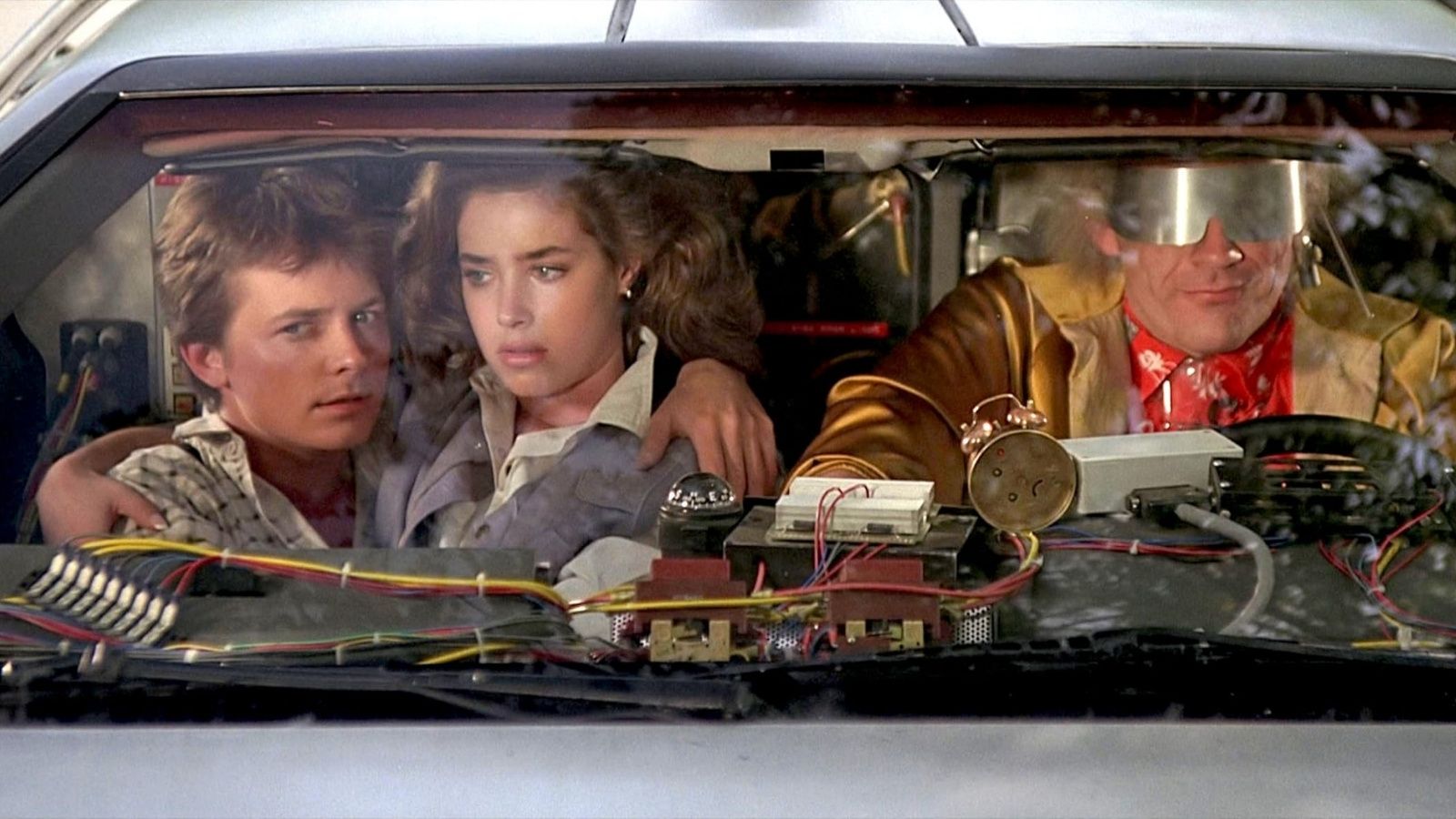 Michael J. Fox, Christopher Lloyd, and Claudia Wells in 'Back to the Future'