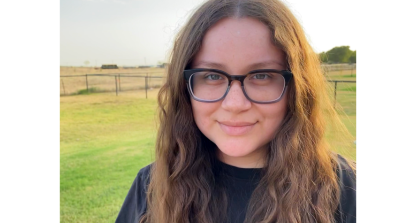 Image of Big Break Winner Natalie Messier standing outside in a large green field