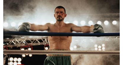 Image of Orlando Bloom leaning against the boxing ring ropes, his face bloodied in 'The Cut'