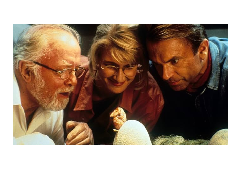 Richard Attenborough, Laura Dern, Sam Neill watching a baby dinosaur hatch in 'Jurassic Park'