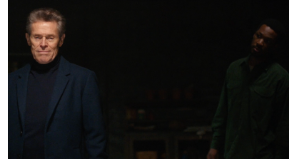 Willem Dafoe looks straight into camera as Corey Hawkins stares at him from the shadows in The Man in My Basement