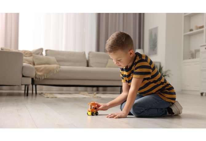 child playing with toy truck