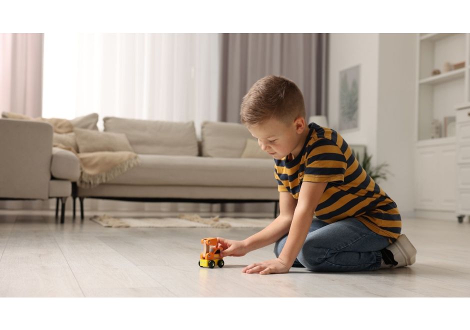 child playing with toy truck