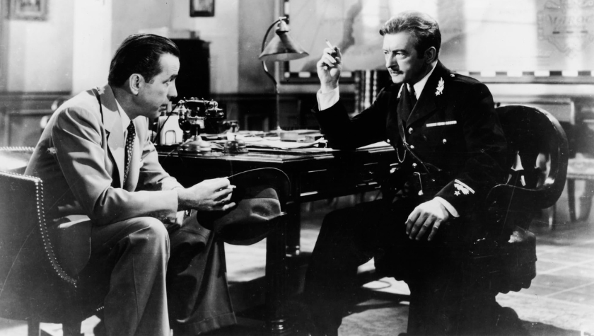 Humphrey Bogart and Claude Rains sit in an office in 'Casablanca'