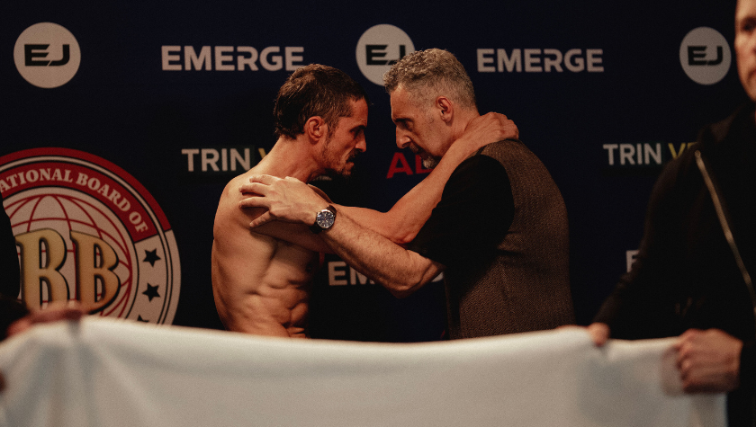 Orlando Bloom and John Turturro stare each other down, psyching the each other up in The Cut