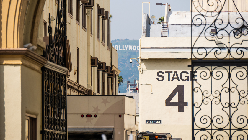Image of a studio entrance featuring Stage 4, with the Hollywood sign in the background