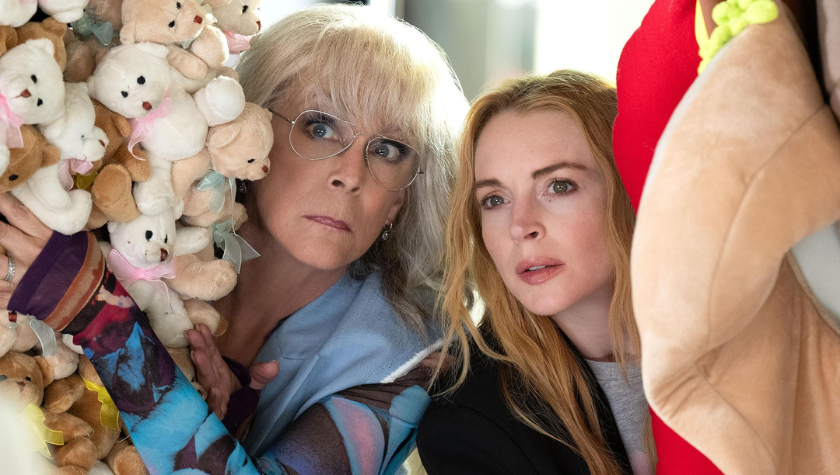 Jamie Lee Curtis and Lindsay Lohan peek out from a display of stuffed animals in Freakier Friday