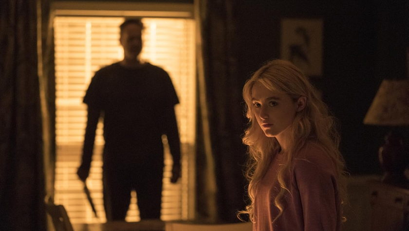 Vince Vaughn stands in the doorway with a knife as Kathryn Newton sits on a bed in Freaky