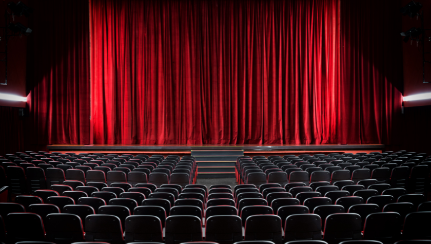 movie theatre with the red curtain hiding the screen behind